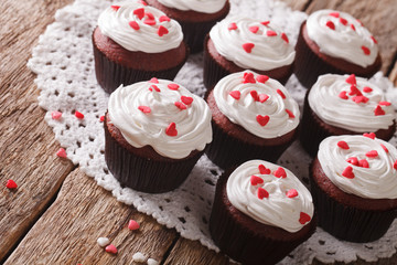 Freshly red velvet cupcakes close-up on the table. Horizontal