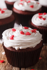 beautiful red velvet cupcakes on a table macro. vertical
