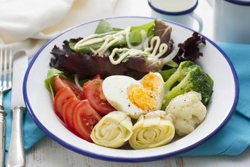 vegetable salad with boiled egg on plate