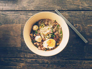 close up thai noodle on wood table with space