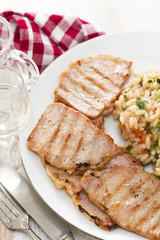 grilled meat with rice on white plate