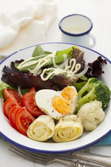 vegetable salad with boiled egg on plate