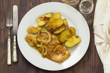 cod fish with potato on white dish
