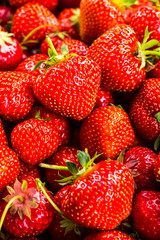 Strawberry on wood background. Strawberry with green leaves flow