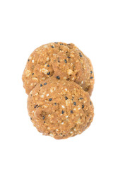 Oatmeal cookies with nuts and sesame seeds isolated on white bac