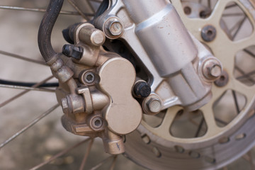 Fototapeta na wymiar detail of a motorcycle's front wheel