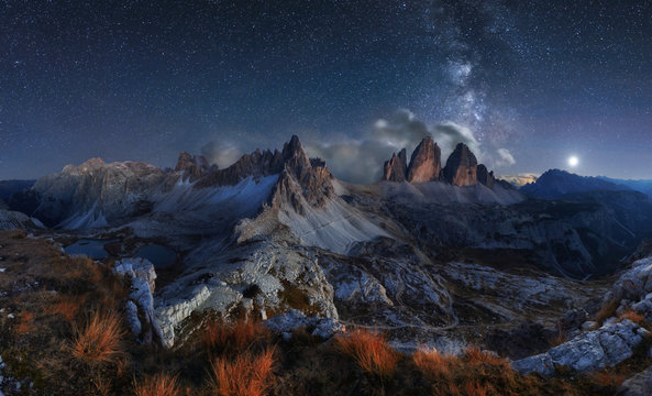 Fototapeta Alps Mountain landscape with night sky and Mliky way, Tre Cime d