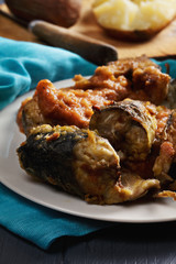 Fried fish and potato skins closeup