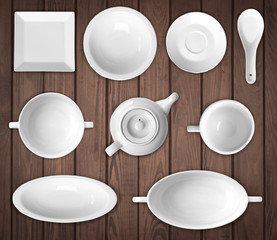 white dishes on a wooden background