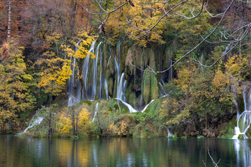 Landscape, waterfall and forest in autumn colors