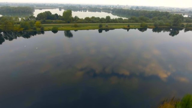 Mirror lakes - sky reflecting of lake surface, Fen Drayton, UK, aerial view
