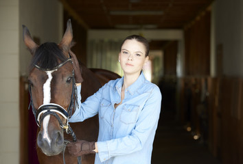 Young woman with her horse