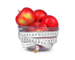apples in a glass bowl on white background