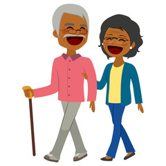 Lovely African American senior couple laughing and talking walking together