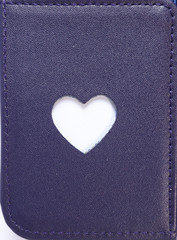Blue leather texture closeup with heart shape cutting in the middle, useful as background. Love and romantic concept. Heart shape can insert a text message, a name of a lover or a photo of a lover.