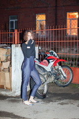 Young girl smokes about motocross bike