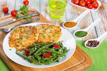 portion of meat fritters served with stew green beans
