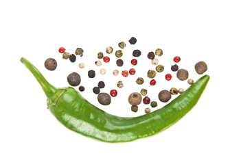 Green chili pepper and mixed peppercorn on a white background