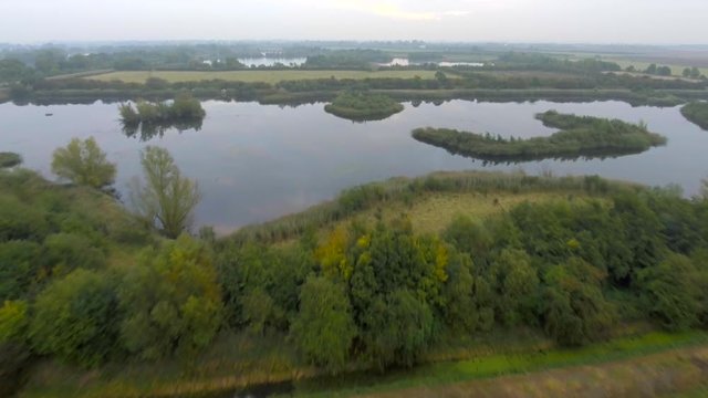 British nature reserve - lakes and riverside meadows. Aerial view