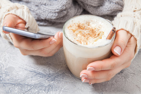 woman hands with a latte