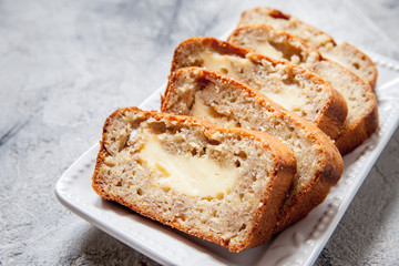 Sliced banana bread with cream cheese