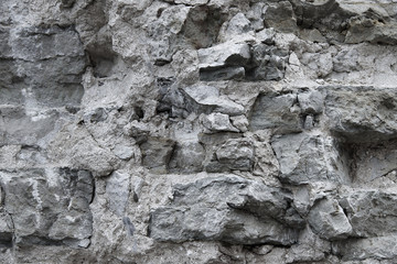 Old grey stone wall background texture