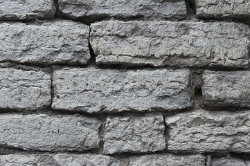 Old grey stone wall background texture