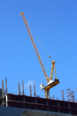 Fototapeta na wymiar machinery crane working in construction site building