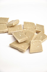 pieces of white chocolate on white background