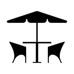 Cafe table and chairs under an umbrella © dnbr