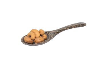cashew nuts in spoon wood isolated on white background