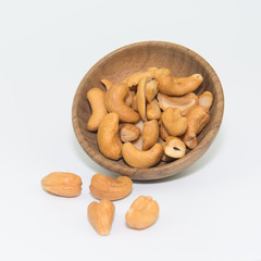 cashew nut in wood bowl on white