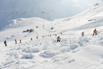 Fototapeta na wymiar Ski slope avalanche covered with skiers around