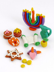 Hanukkah handmade plasticine toys. Modeling clay colorful texture. Isolated on white background.
