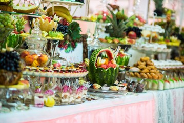 Obraz na płótnie Canvas Wedding reception. Table with fruits and sweets
