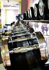 Fototapeta premium Dumbbells at the fitness center