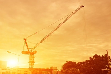 The Crane in construction site at sunset background