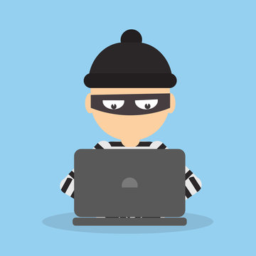 Robber at the office. Bad thief downloading information from computer. Man in the black mask and striped outfit.