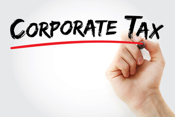Hand writing Corporate tax with marker, concept background