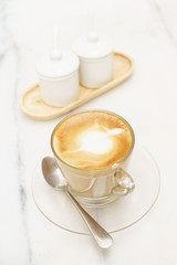 coffee latte glass cup on white marble table