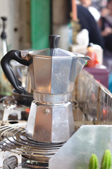 Classic Italian coffee pot boiling on stove