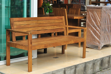 Fototapeta na wymiar Long wooden bench, interior furniture