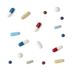 Aerial view of assorted tablets and medicine, isolated on a white background