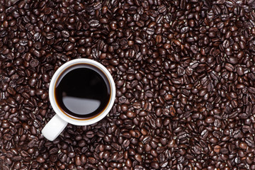 White cup of hot, fresh and aromatic coffee, detail view from to