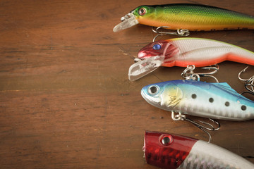 Set of Fishing Lure on wood table with copy space