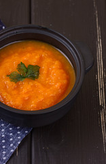 pumpkin soup in a small black pot
