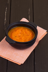 Pumpkin soup on a wooden table