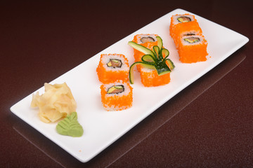 Sushi rolls on a white plate
