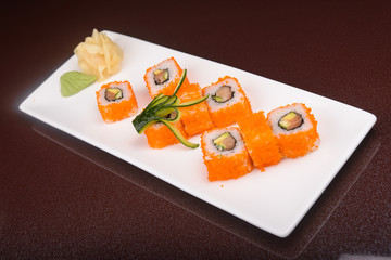 Sushi rolls on a white plate