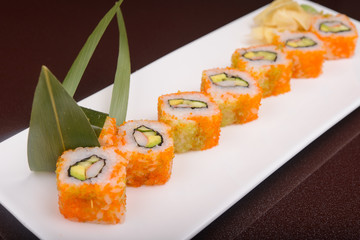 Sushi rolls on a white plate
